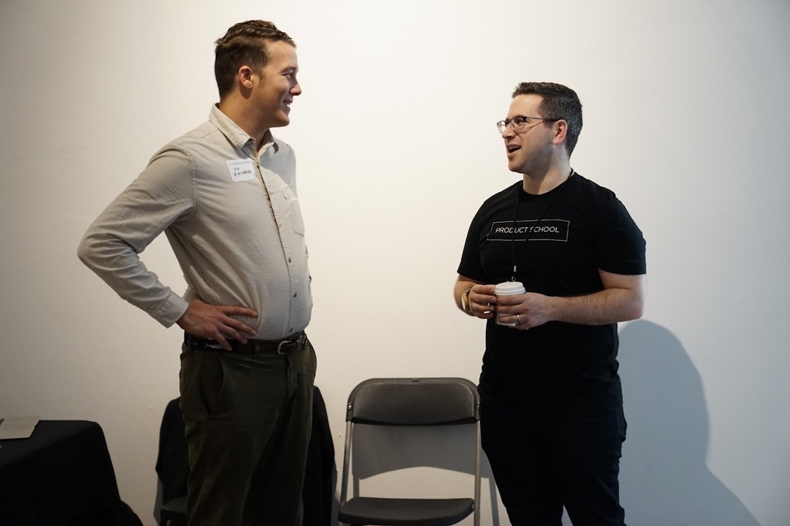 Two church leaders standing and talking together.